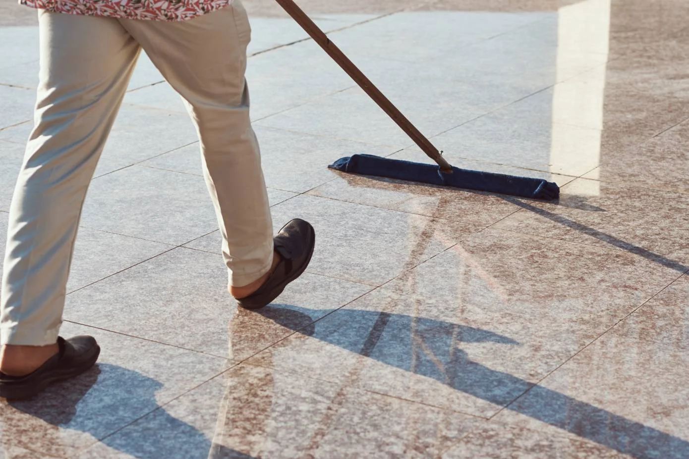 cleaner-with-a-mop-cleaning-marble-floor-outdoors-2023-11-27-05-23-05-utc